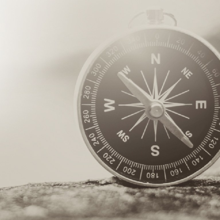 Black and white photo of a compass