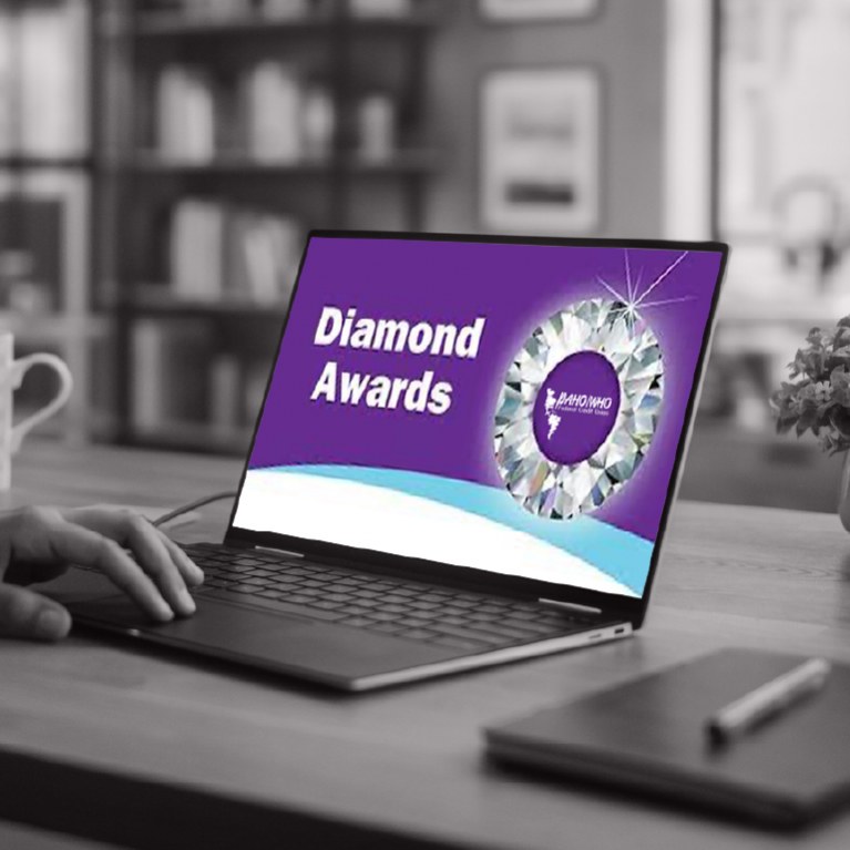 a purple diamond circle with the paho who logo in the middle and the words diamond awards