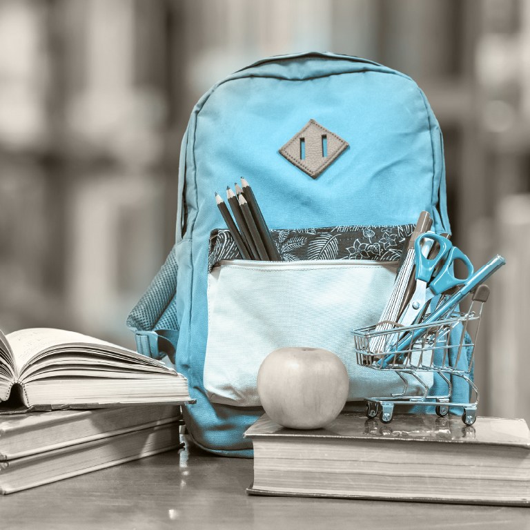 bright blue backpack with back to school supplies