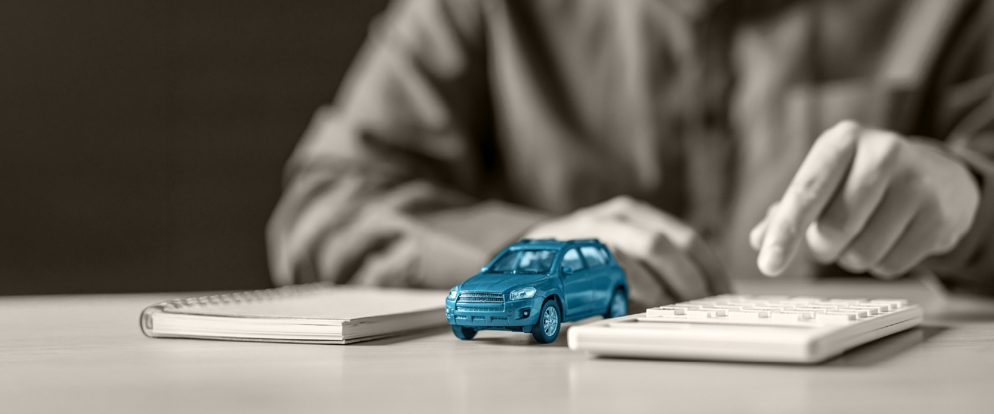 teal wooden auto on desk